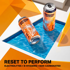 Rockstar can beside gym towel and water bottle after workout, supports post-exercise refresh