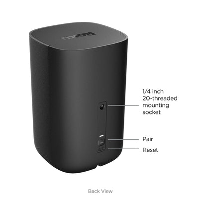 Roku speaker next to book showing compact size and scale