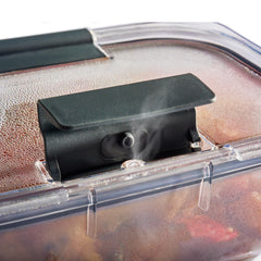 Rubbermaid container in microwave with vent open demonstrating mess-free reheating convenience