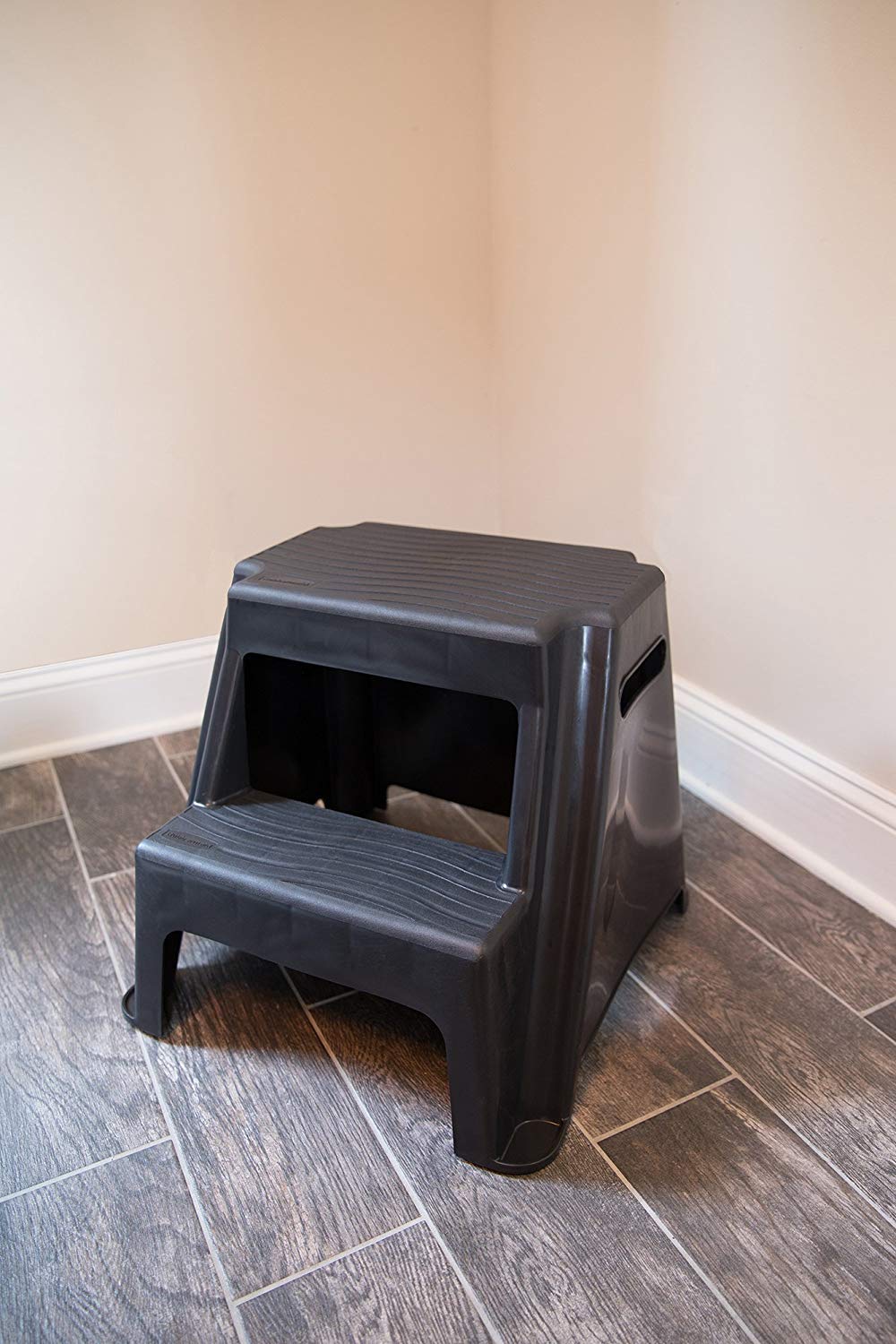 Rubbermaid stool stored beside cabinet illustrating compact storage benefit