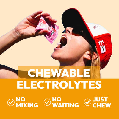 Close-up of SaltStick FastChews orange tablets showing texture and chewable size