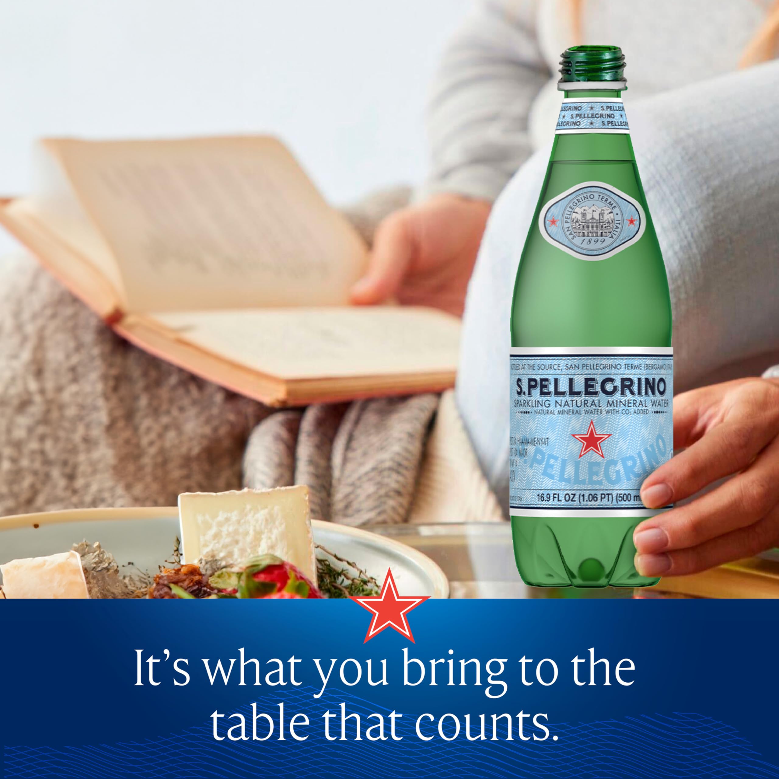 San Pellegrino botella junto a mano, escala y tamaño práctico