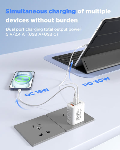 SandFox powering phone, tablet, and earbuds on kitchen counter demonstrating simultaneous charging