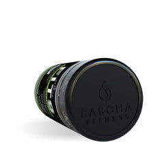 Sascha Fitness cápsula junto a moneda para escala de tamaño