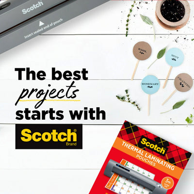 Scotch TL901X on a desk with crafts and photos highlighting versatile home and office use