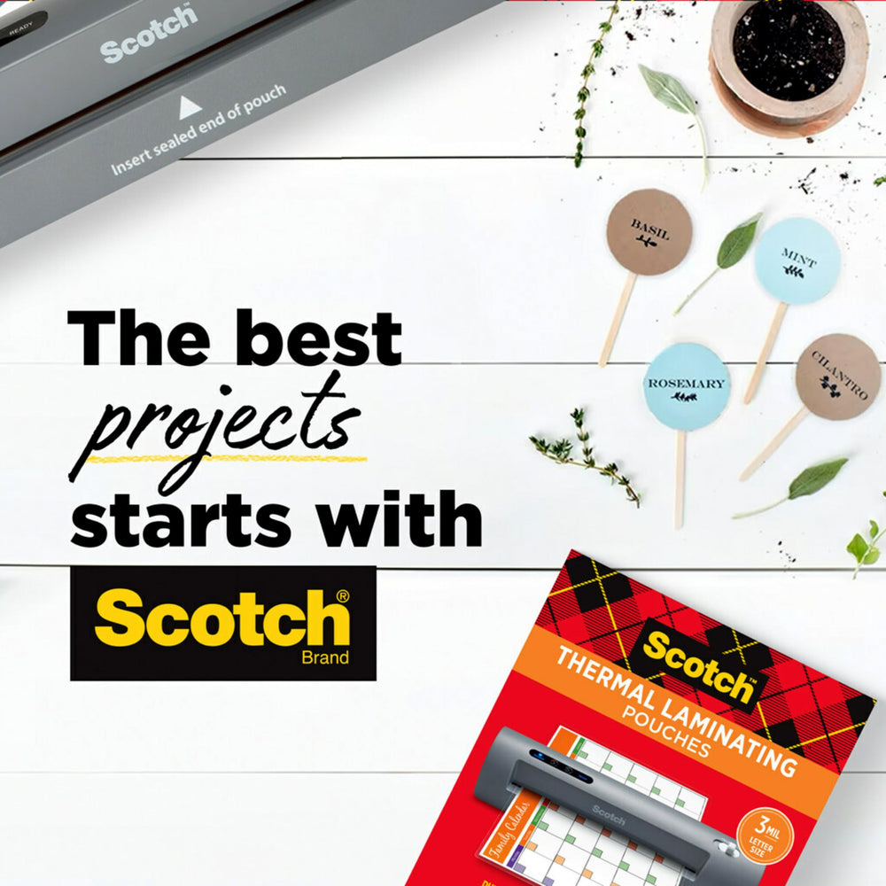 Scotch TL901X on a desk with crafts and photos highlighting versatile home and office use