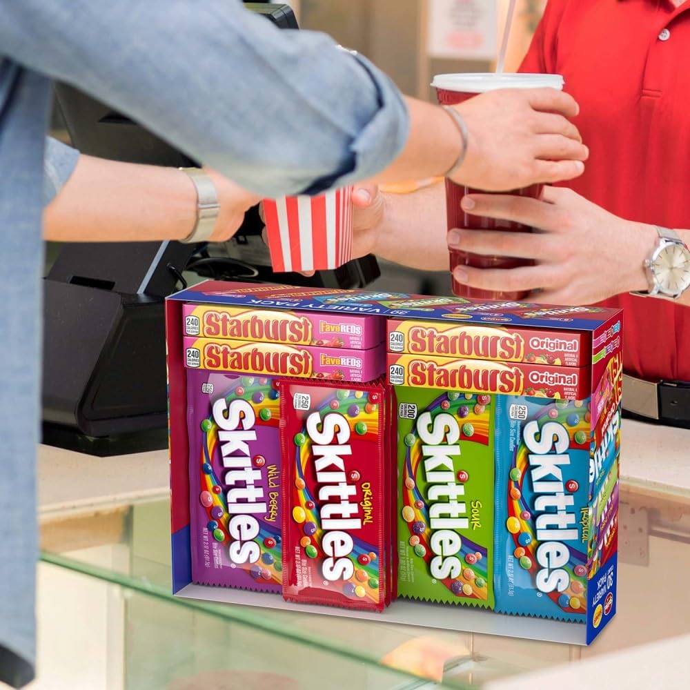 Stack of full-size SKITTLES and STARBURST packs ready for handing out at events