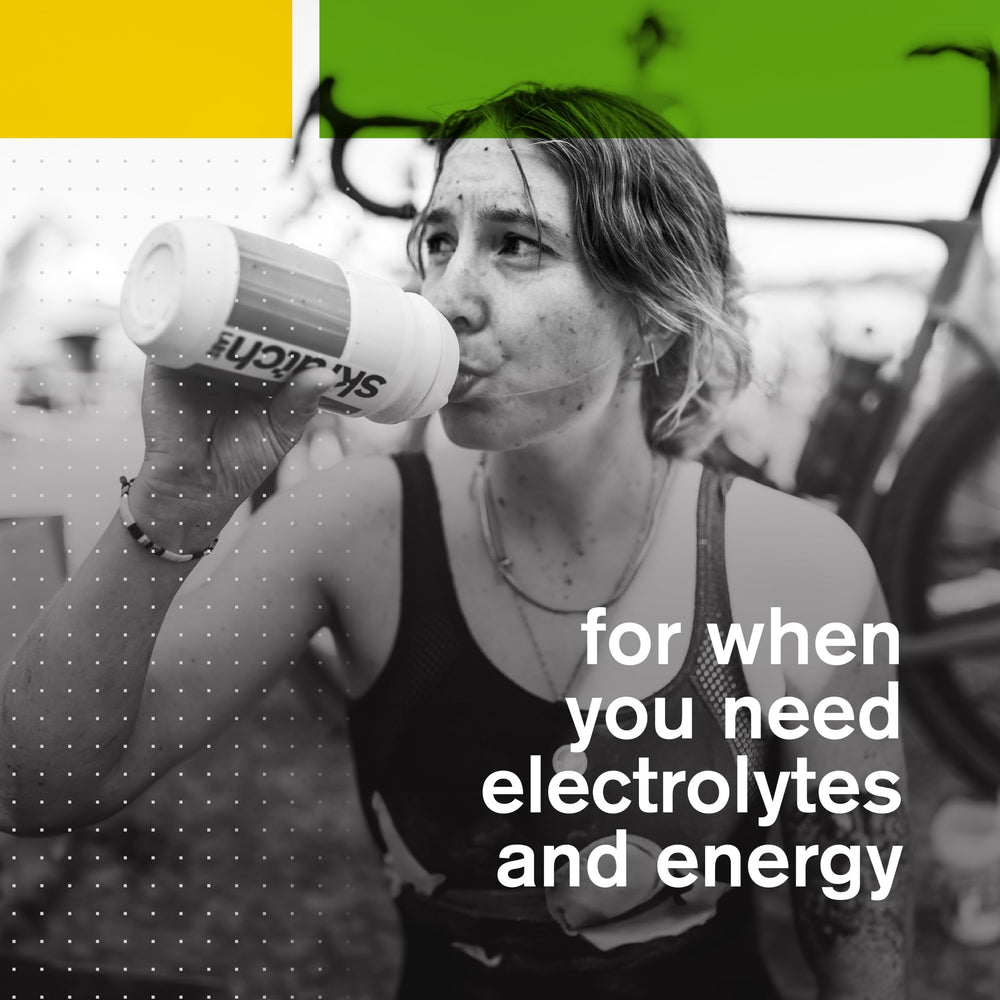 Skratch Labs runner drinking Lemon Lime mix on a trail for endurance