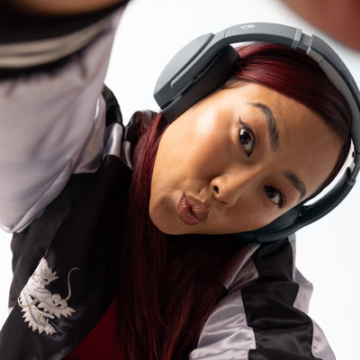 Person wearing Skullcandy Crusher Evo during commute benefit: immersive bass on the go