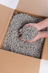 Small Pet Select close-up of paper pellets, highlights high absorbency benefit