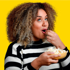 Smartfood movie theater butter bag in hand demonstrating convenient portioning