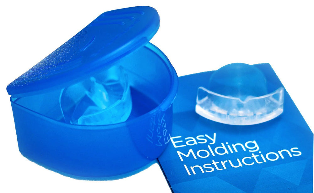 SmartGuard Elite shown beside toothbrush for size and portability