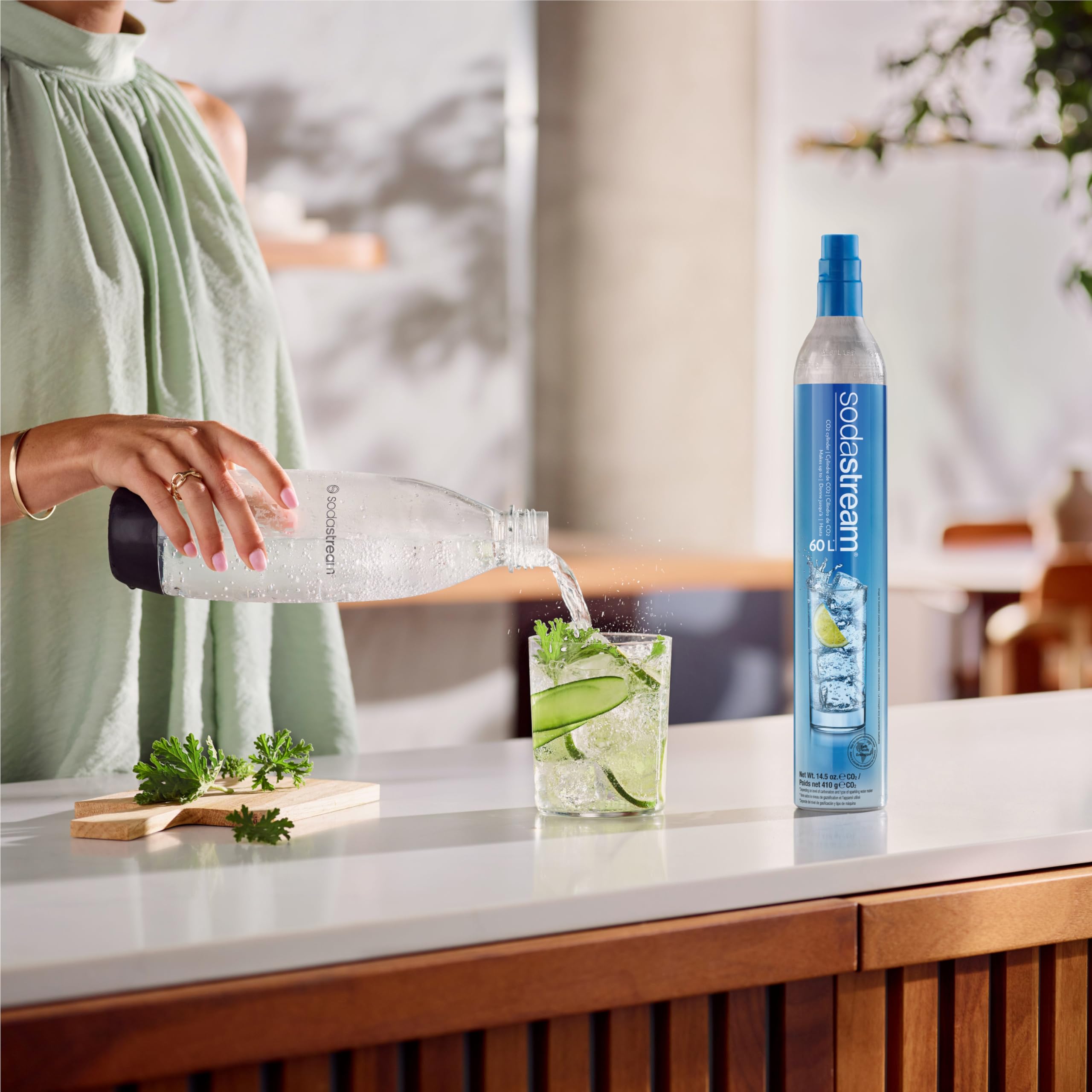 sodastream cylinders in a modern kitchen making sparkling drinks and reducing waste