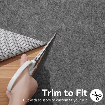 Songrey being trimmed with scissors to fit rug shape for easy customization