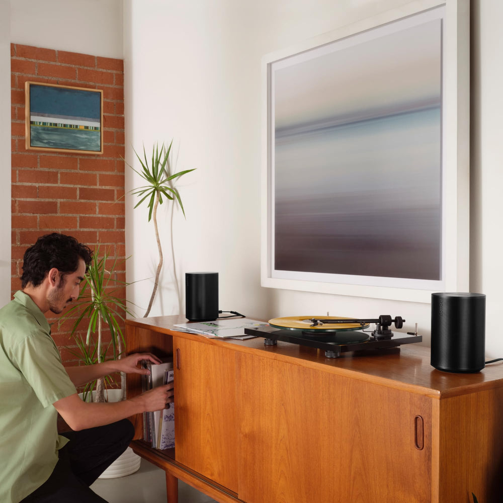 Sonos Era 100 stereo pairing in living room showing wider soundstage benefit
