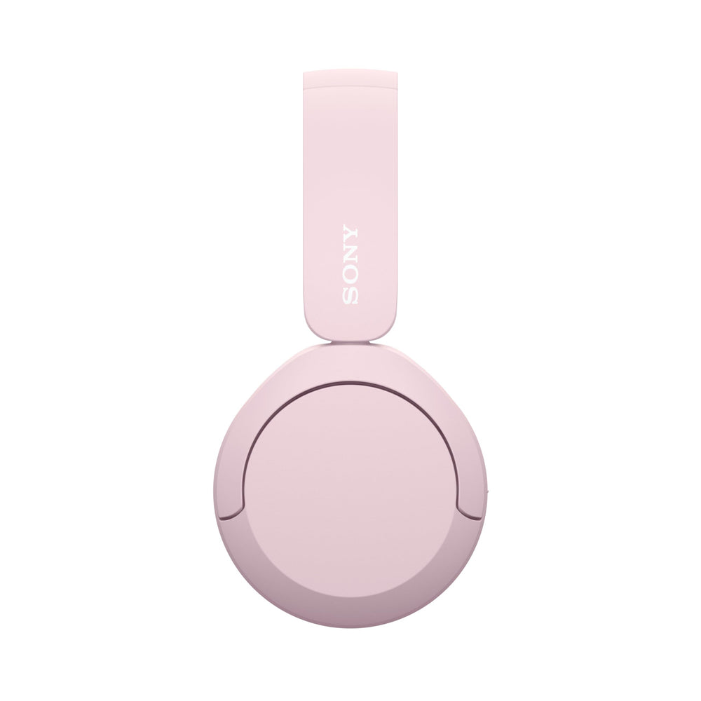 Sony WH-CH520 pink beside phone showing multipoint pairing convenience