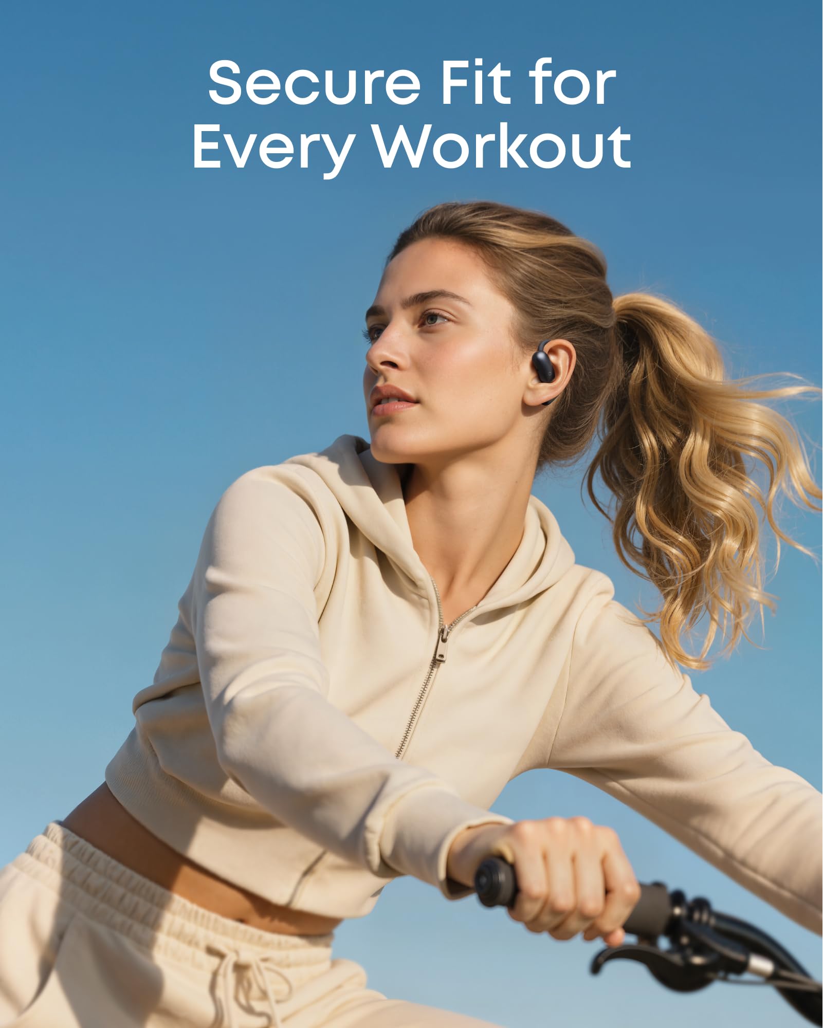 Soundcore AeroFit 2 next to smartphone showing compact scale and pocketability