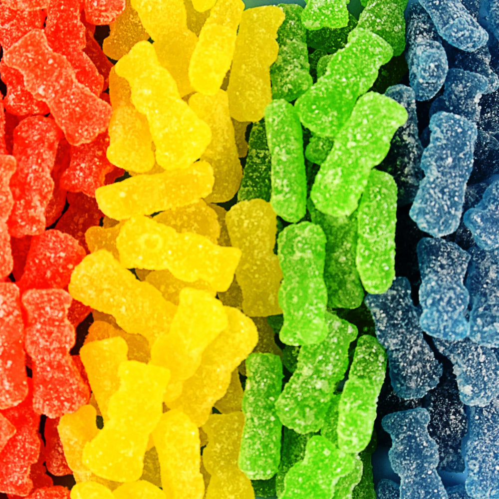 SOUR PATCH KIDS handful beside coin for serving-size clarity