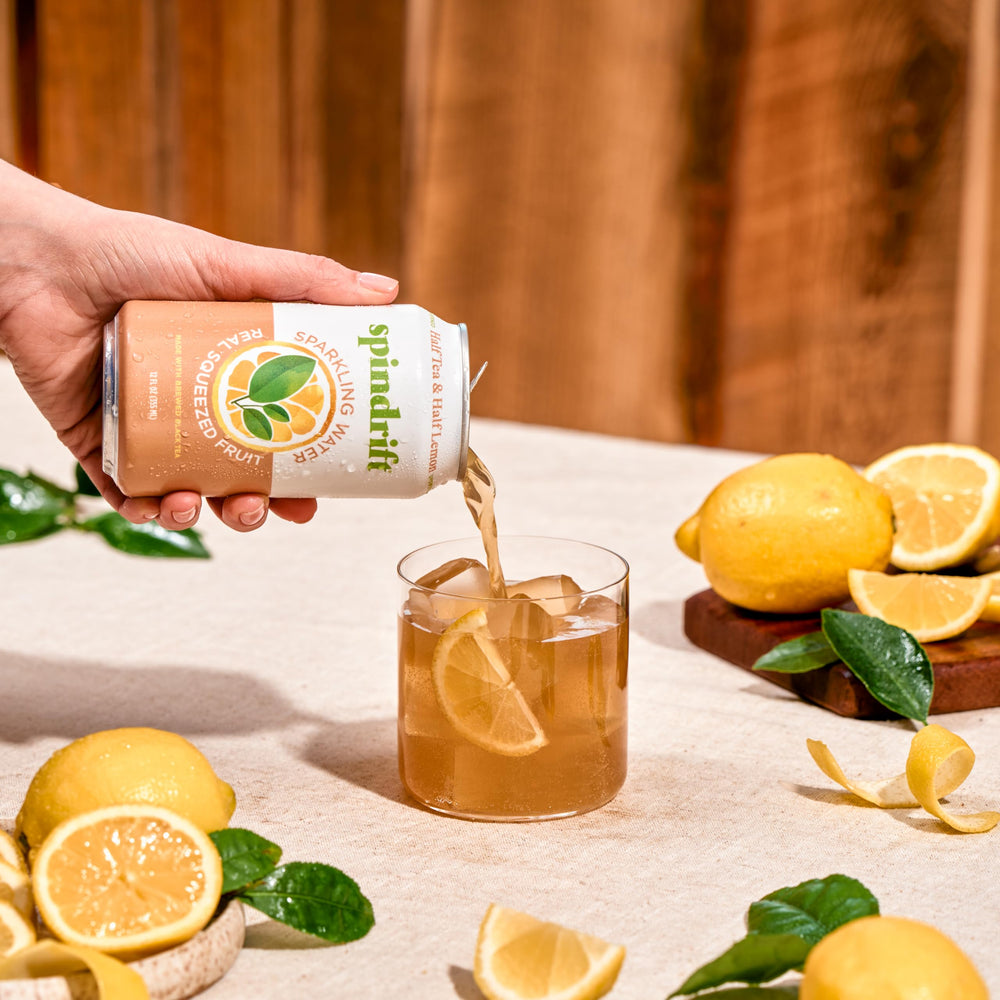 Spindrift can in hand demonstrating 12 fl oz size and portability