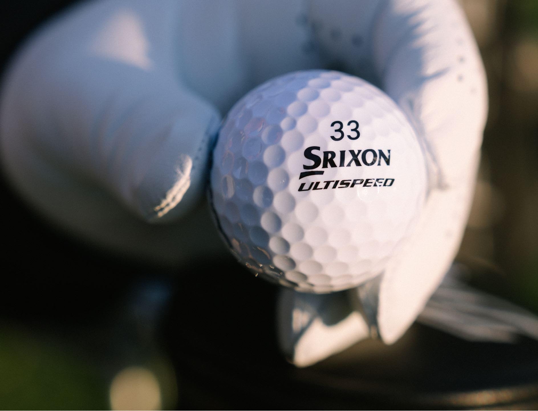 Srixon Q-Star Ultispeed mid-flight over fairway showing stable trajectory