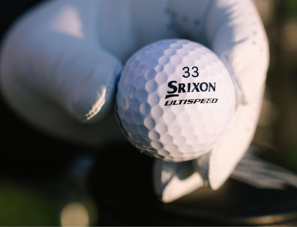 Srixon Q-Star Ultispeed mid-flight over fairway showing stable trajectory