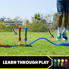 Child stomping Stomp Rocket launcher in action capturing simultaneous two-player launch fun