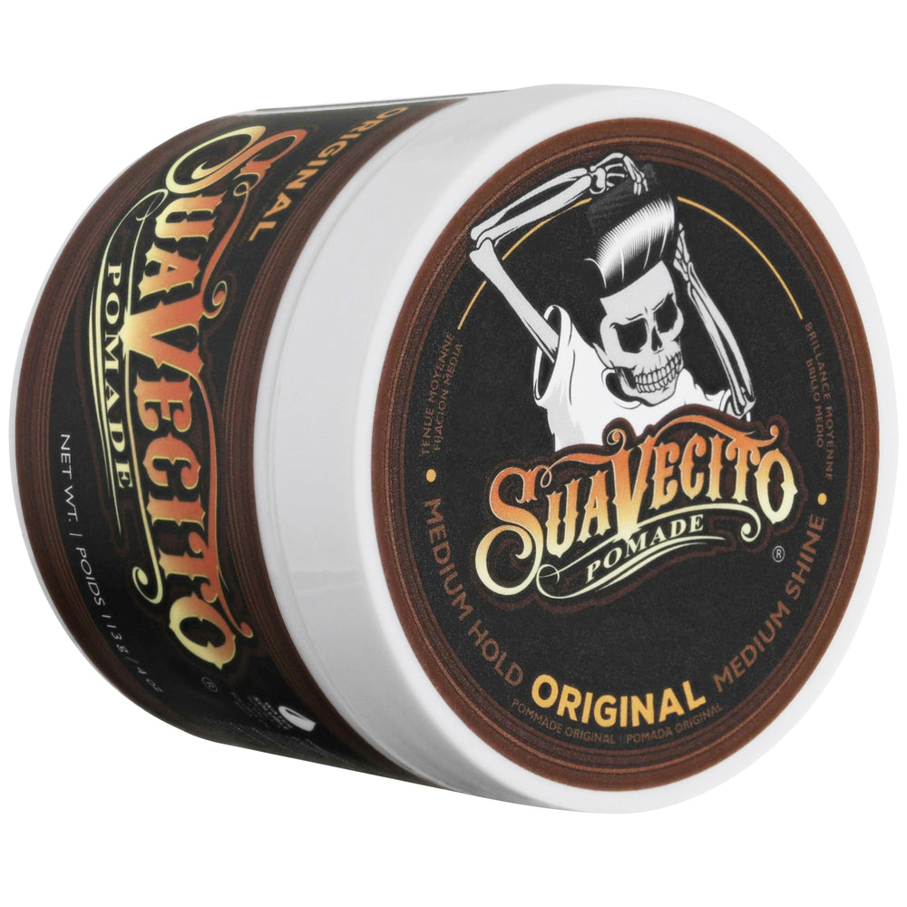 Suavecito Pomade 4 oz jar next to a coin for scale and portability