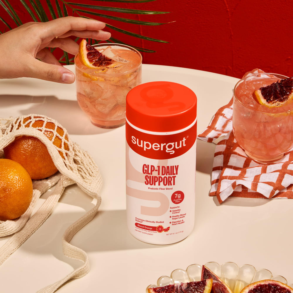 Supergut mixed drink in glass over ice illustrating refreshing, enjoyable fiber boost
