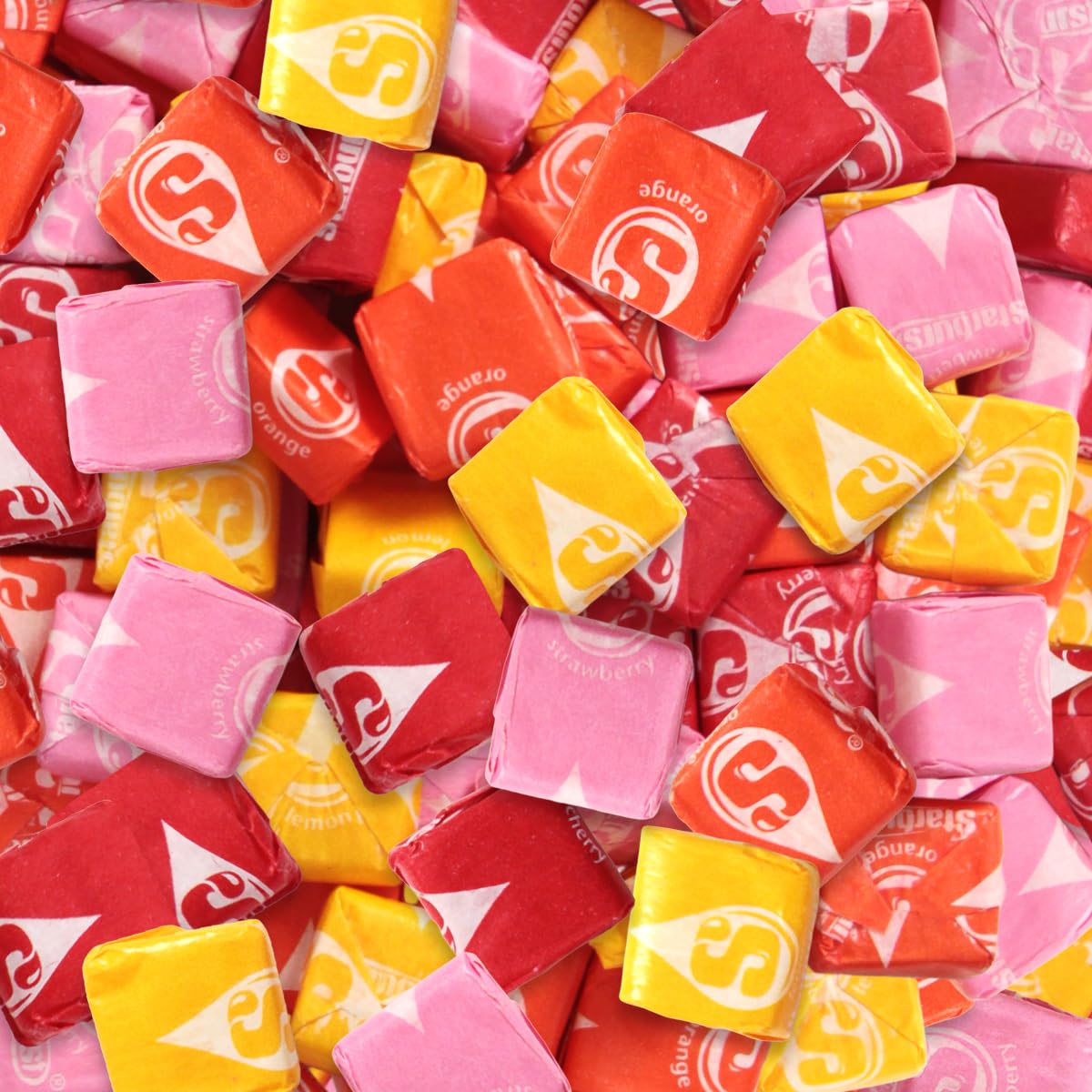 SWEETSIDE CANDY CO. mano sosteniendo una pieza para ver tamaño práctico