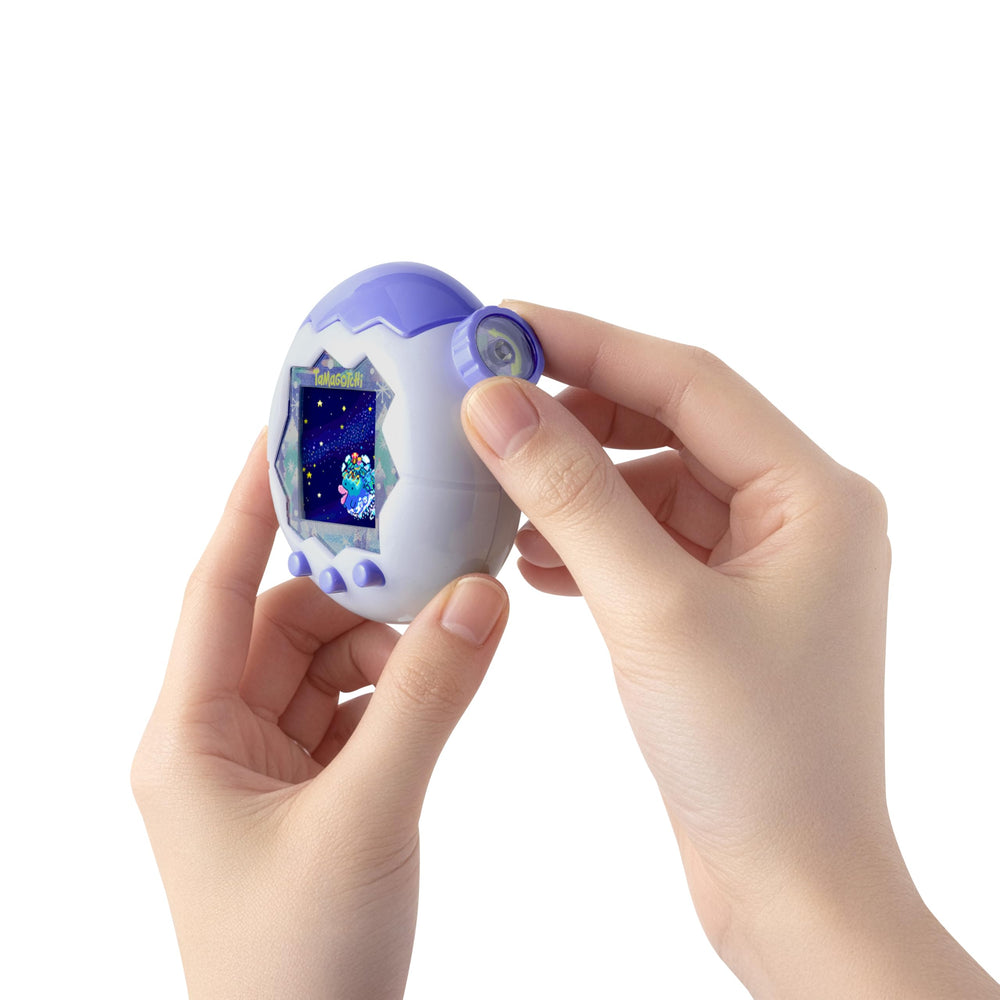 Tamagotchi pantalla con zoom que muestra acción celular interactiva