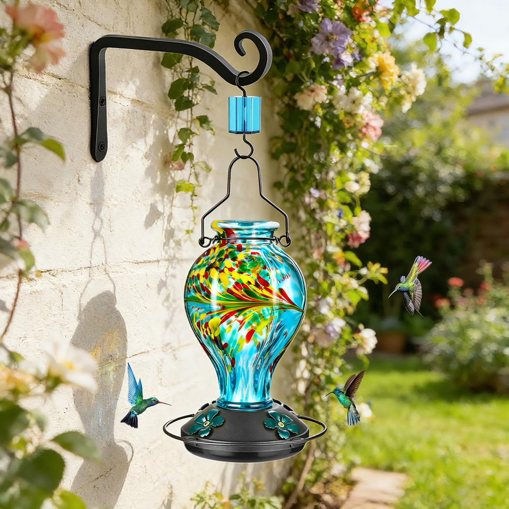 Tegarbed feeder hanging in garden adding color and drawing hummingbirds