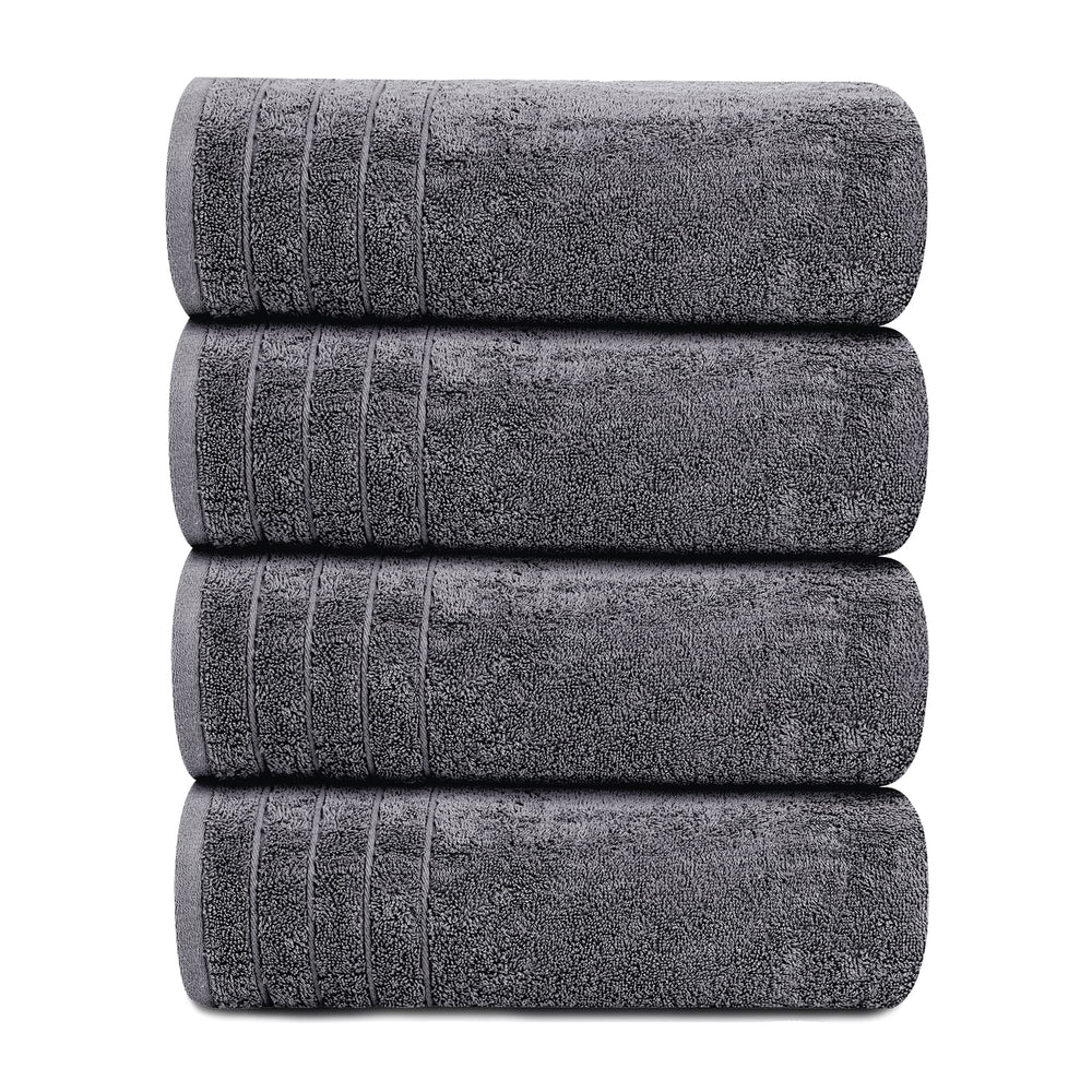 Tens Towels apiladas en un baño decorado, mostrando aspecto ordenado y resistencia al uso diario