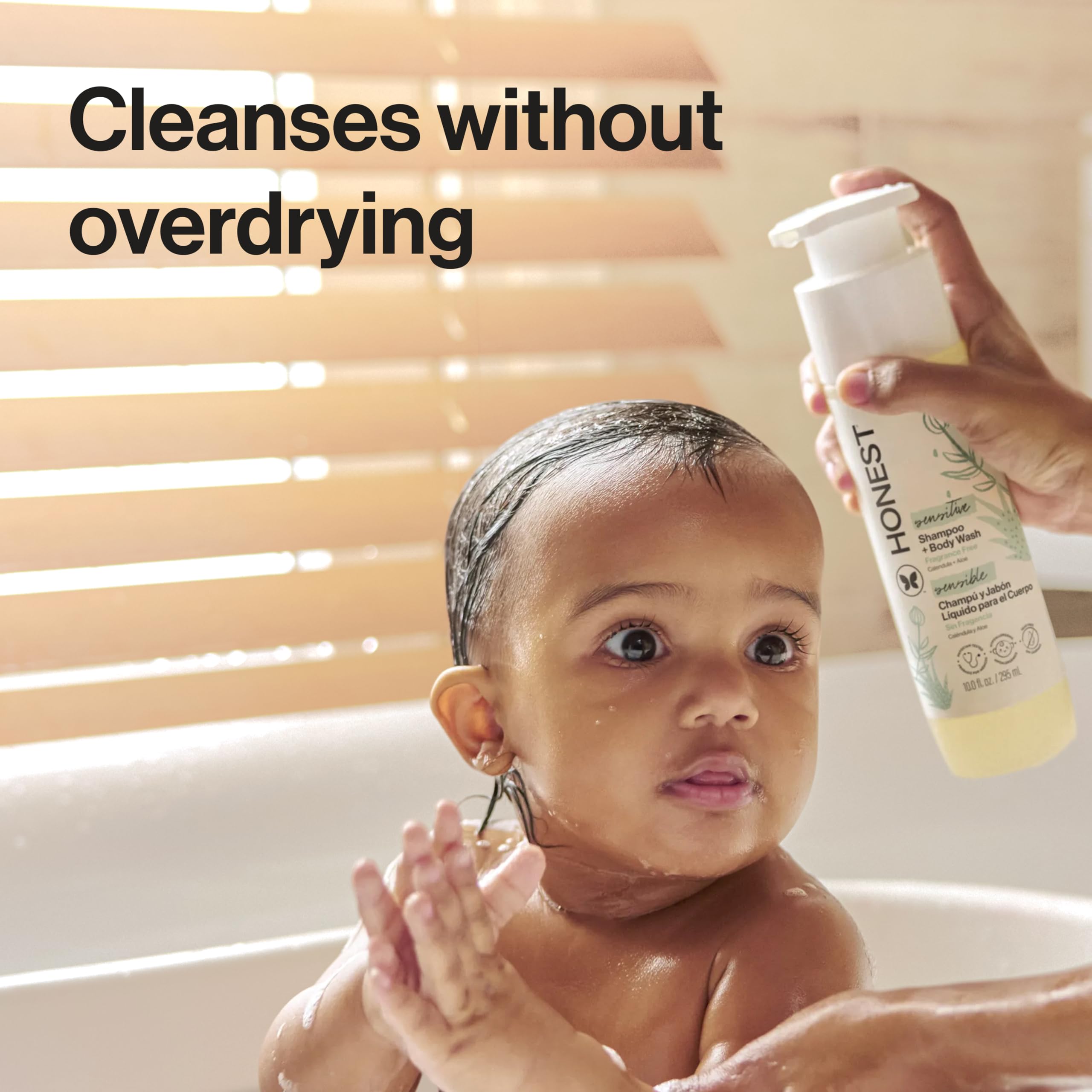 Parent washing baby using The Honest Company gentle shampoo and body wash