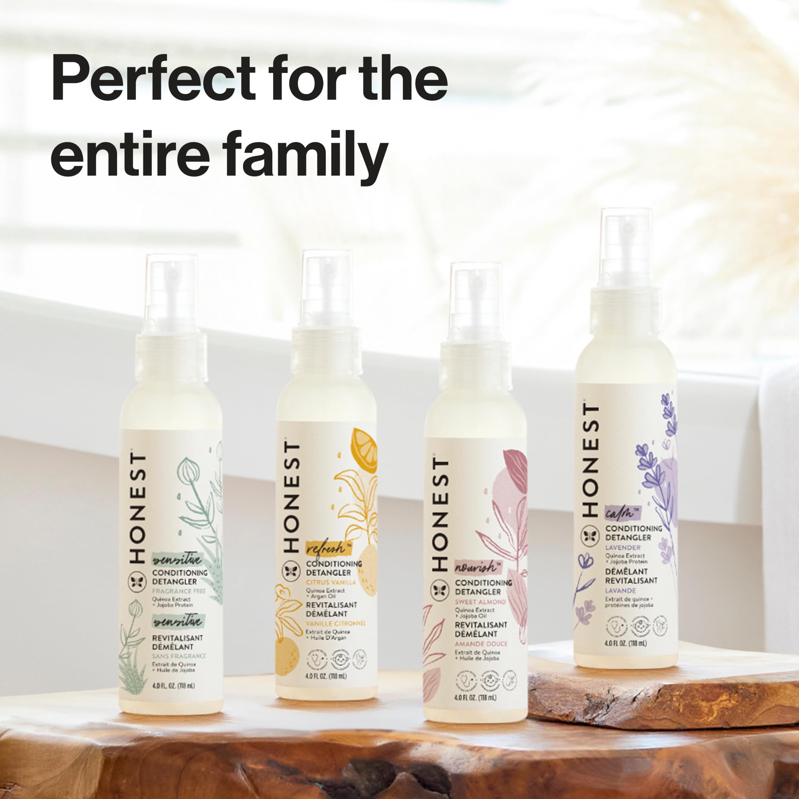 The Honest Company bottle styled with citrus and vanilla props for scent and freshness