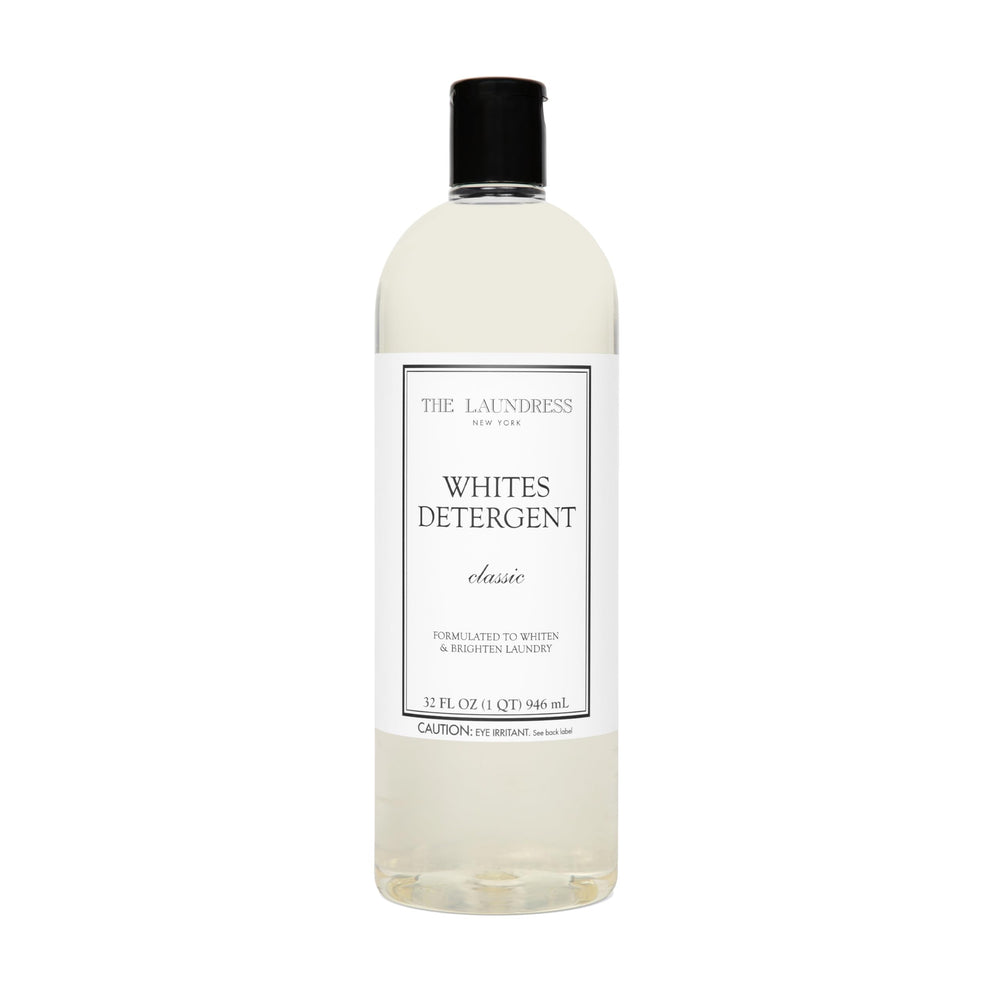 The Laundress envase frontal mostrando diseño y volumen 32 oz, limpieza eficiente