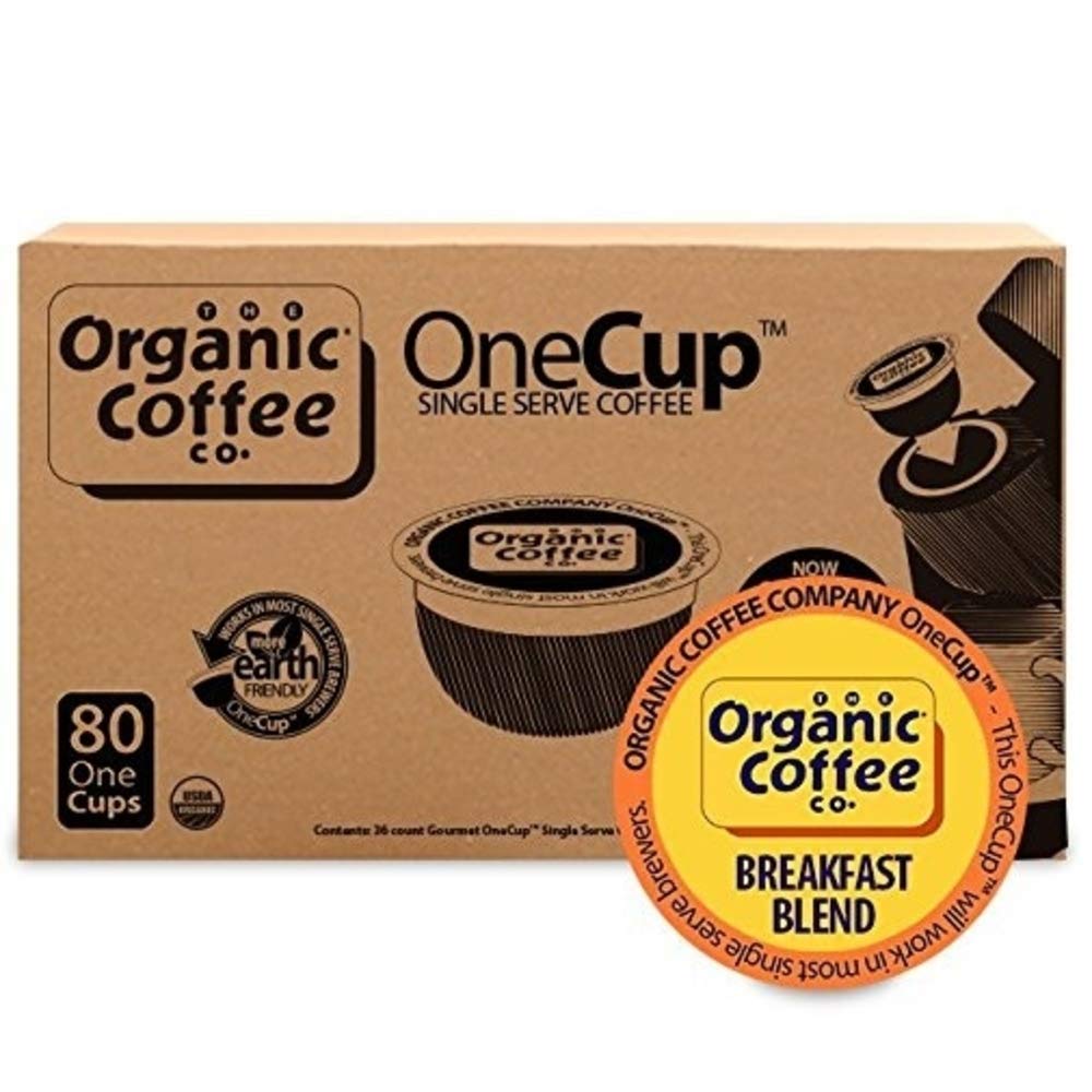 The Organic Coffee Co. pods in hand for scale and easy single-serve benefit