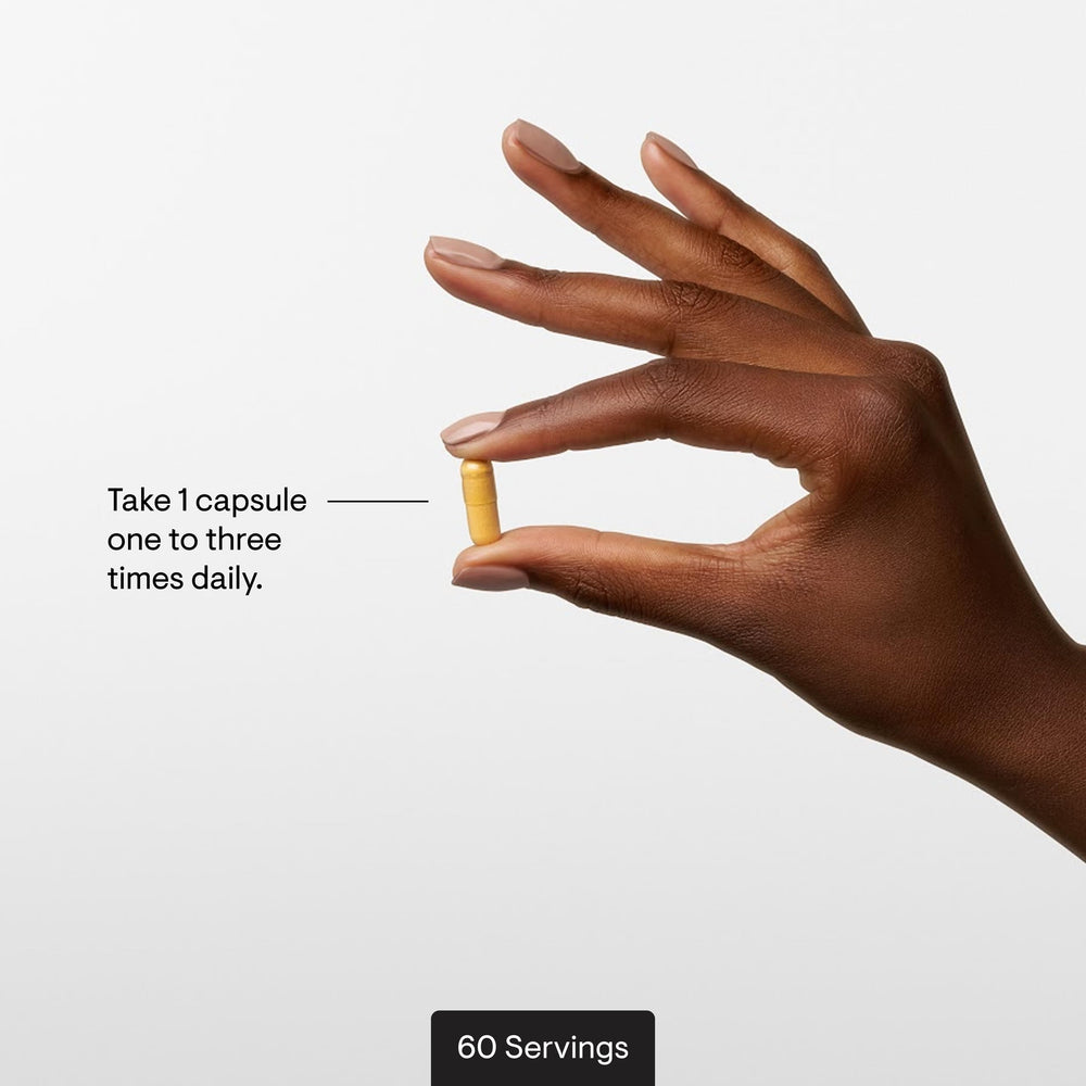 THORNE capsule in hand for scale, demonstrates travel-friendly size benefit