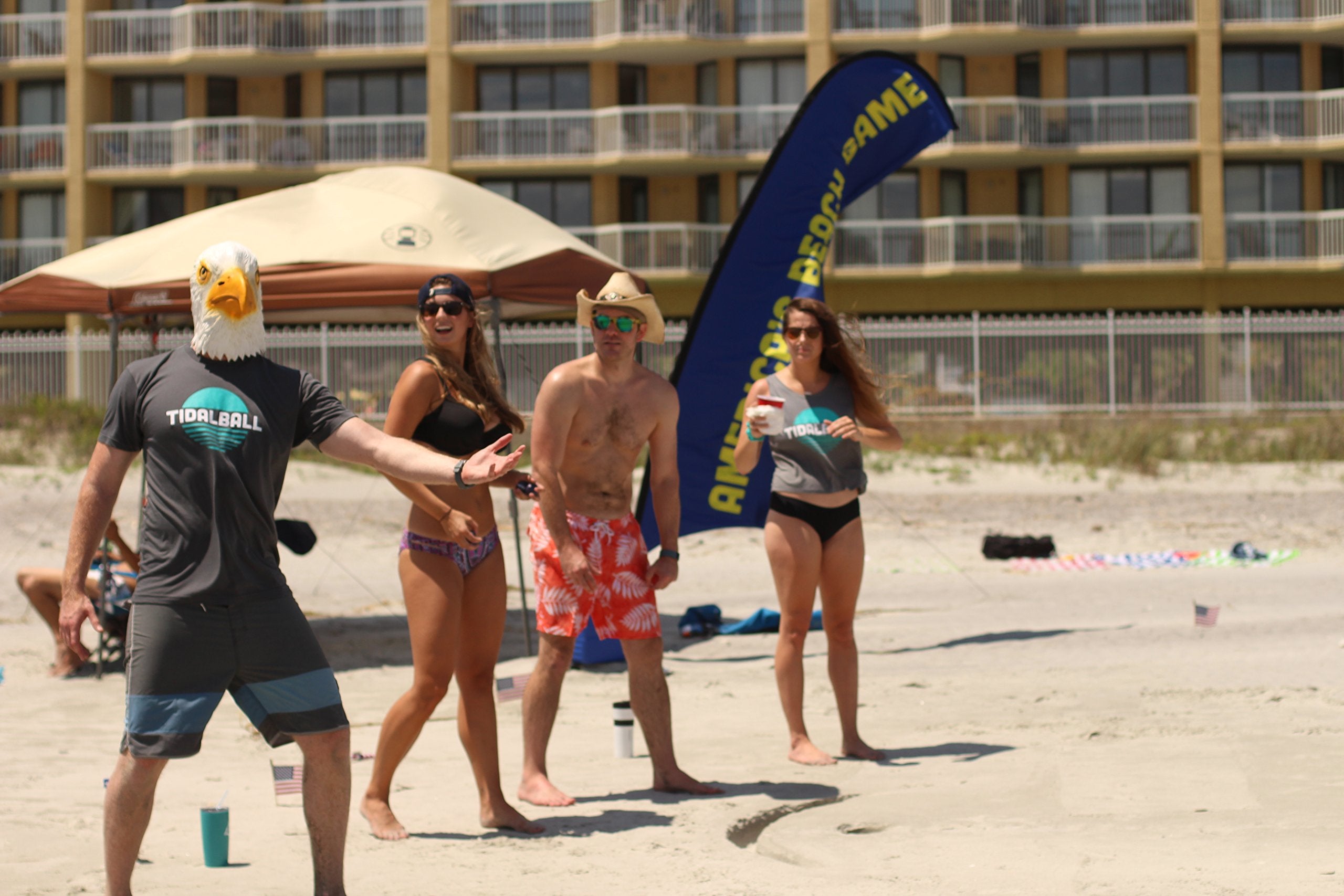 TidalBall in use on the beach with players tossing and social fun