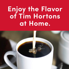 Tim Hortons bolsa de 32 onzas junto a mano para mostrar tamaño real