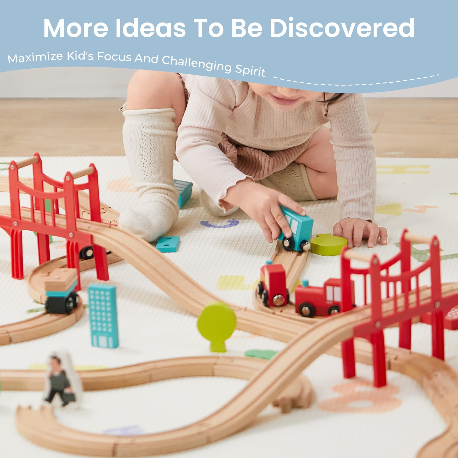 Tiny Land colorful vehicles and track pieces laid out to show included accessories and play variety