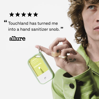 Touchland sprays inside purse scene showing on-the-go freshness benefit