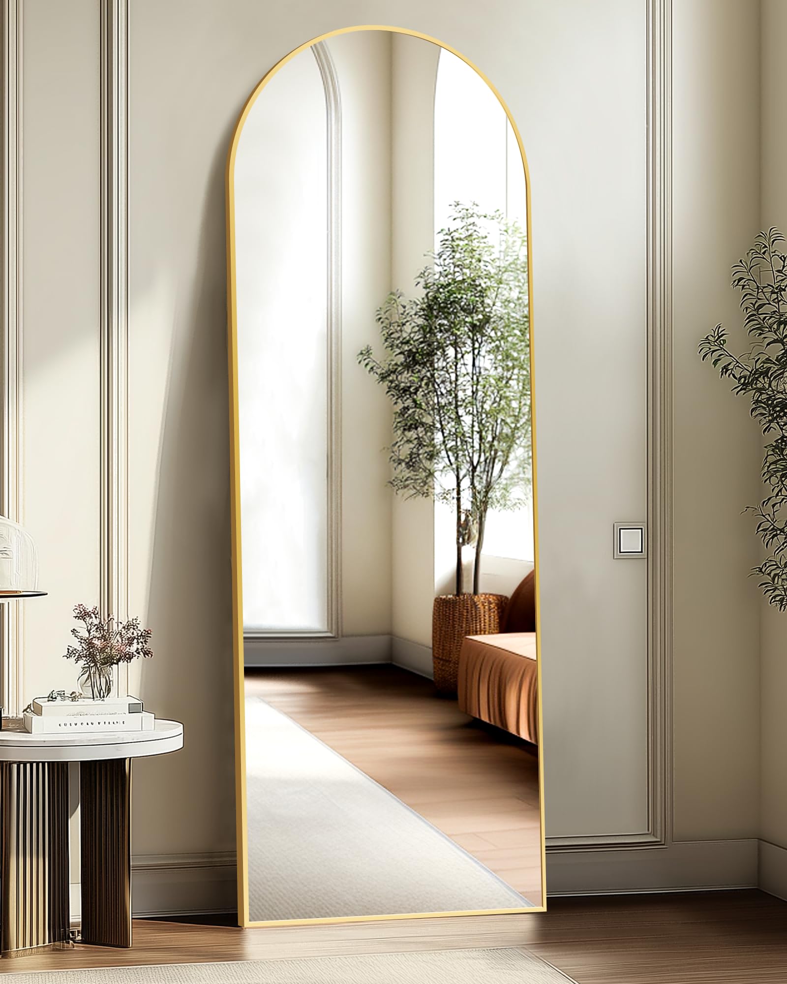 TRAHOME gold arched mirror front view showing slim profile and elegant arch