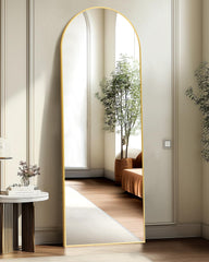 TRAHOME gold arched mirror front view showing slim profile and elegant arch