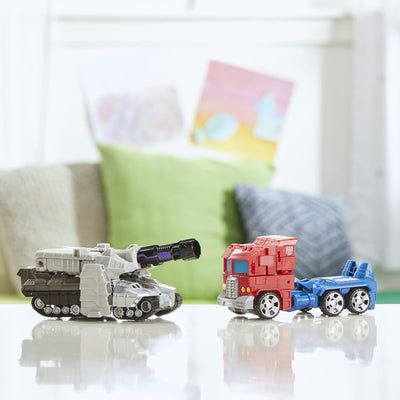 Transformers Megatron tank mode beside toys for scale, brand showing scale and play benefit