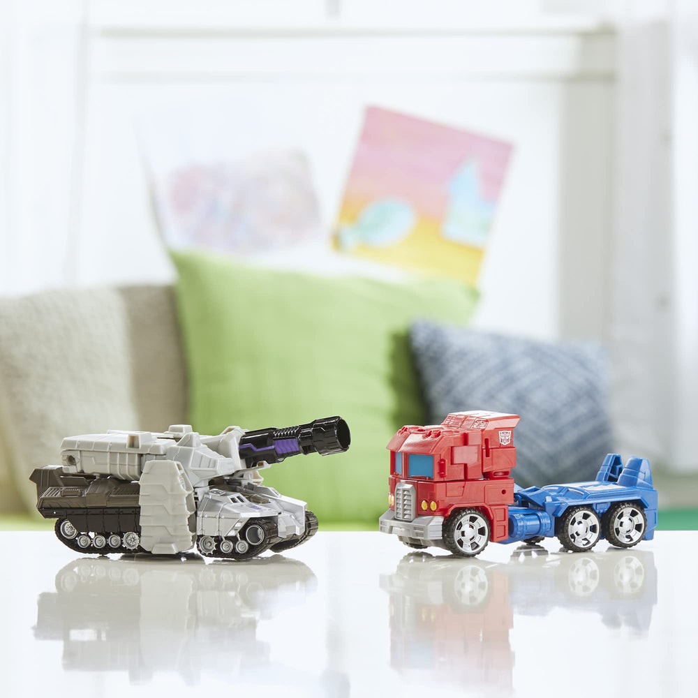 Transformers Megatron tank mode beside toys for scale, brand showing scale and play benefit