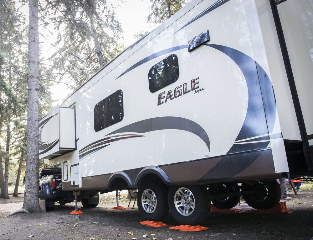 Tri-Lynx blocks in use under an RV wheel providing stable lift