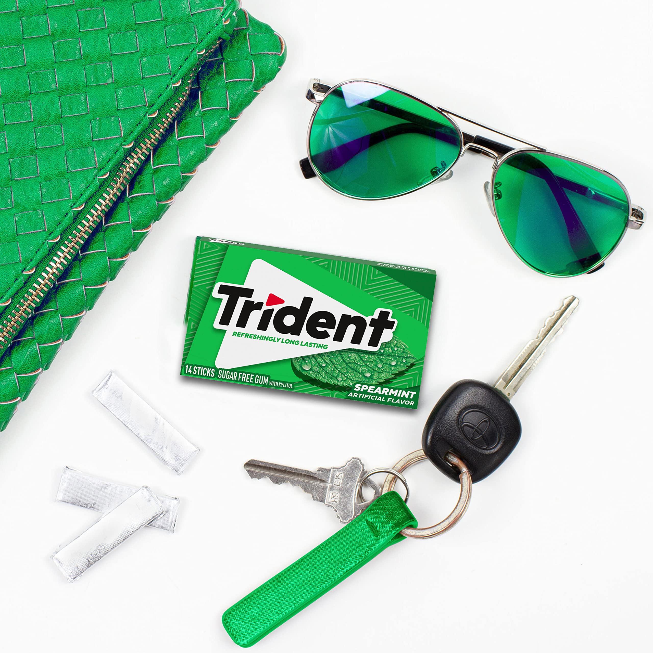 Trident pack beside a smartphone to show portable size and convenience