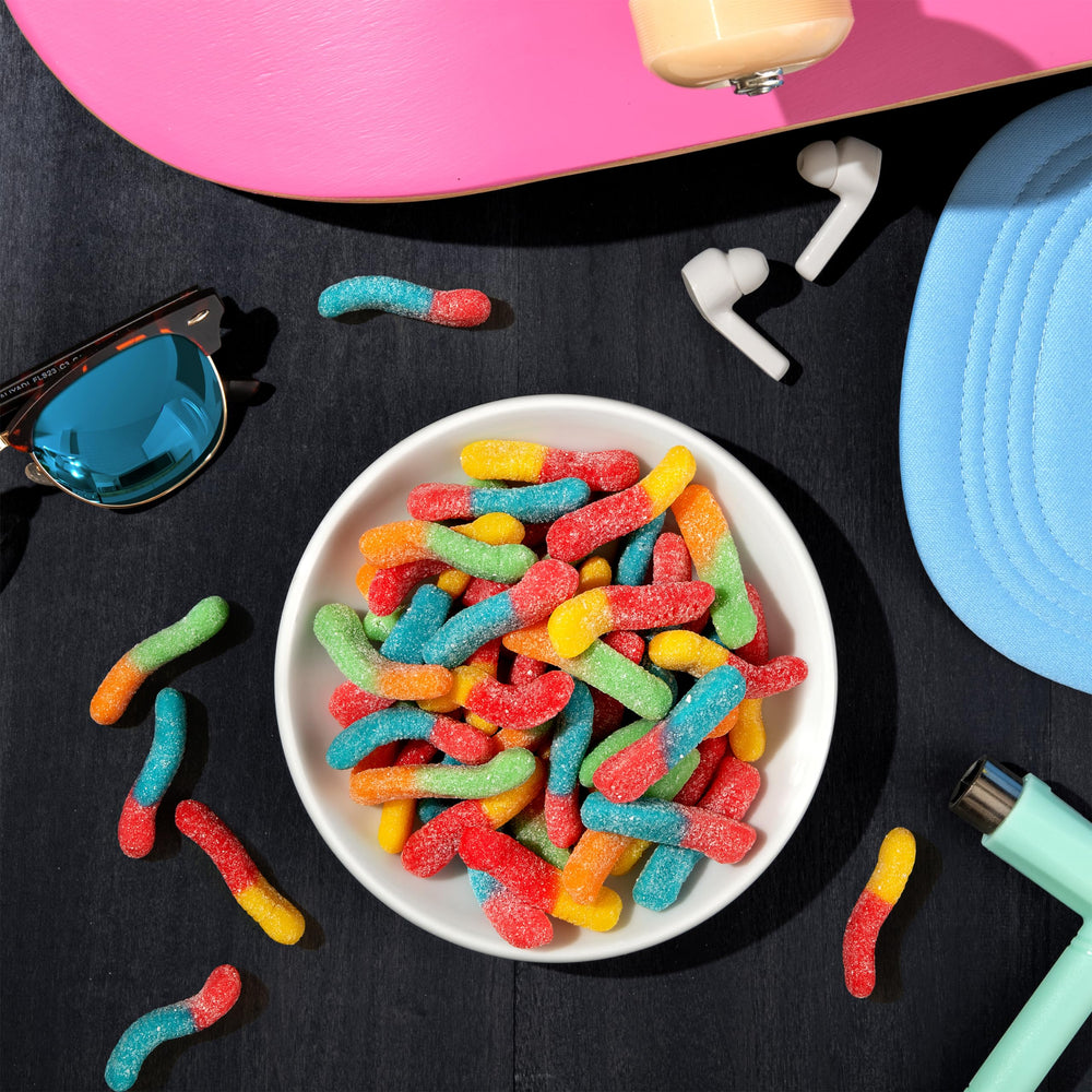 hand holding a handful of Trolli worms to show scale and generous portions
