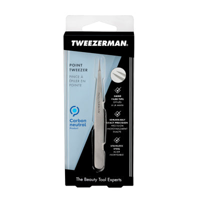 Tweezerman pinza junto a regla para comparar tamaño y escala