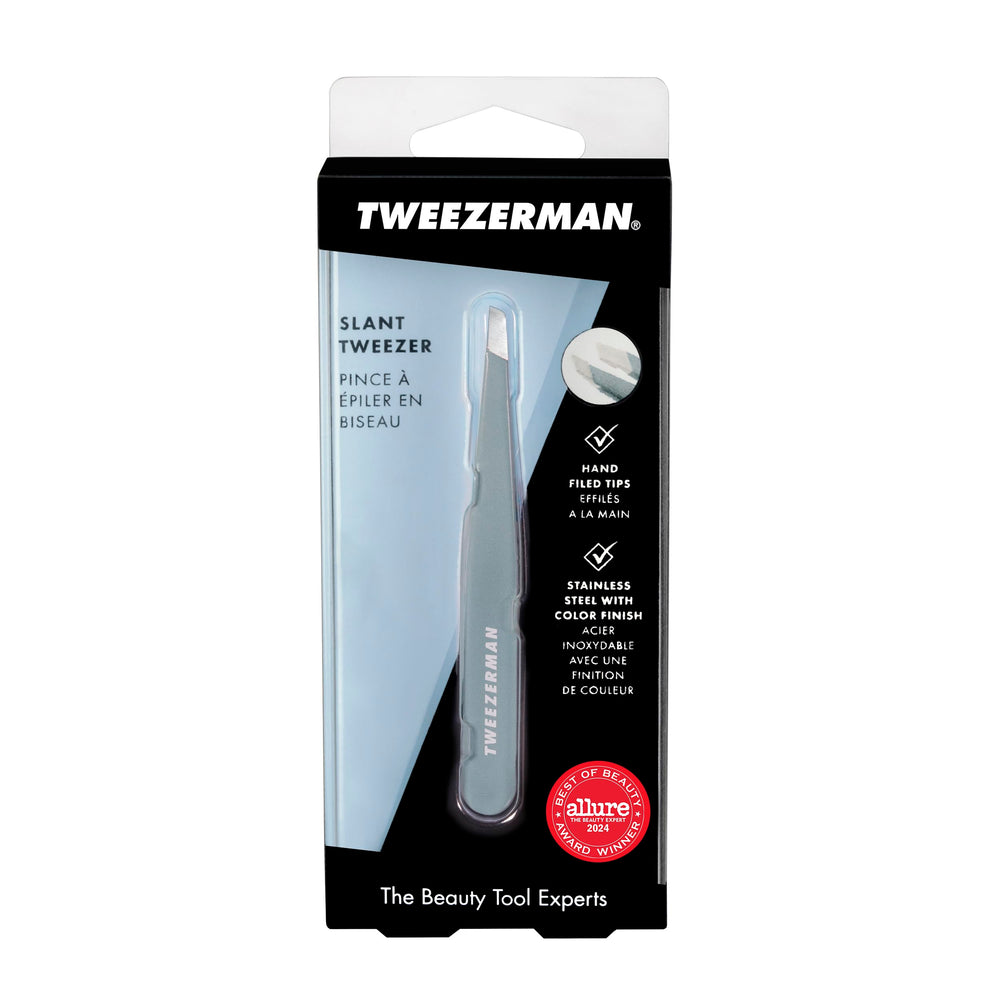 Tweezerman junto a regla mostrando tamaño compacto y control profesional